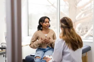 A woman talking to her doctor.