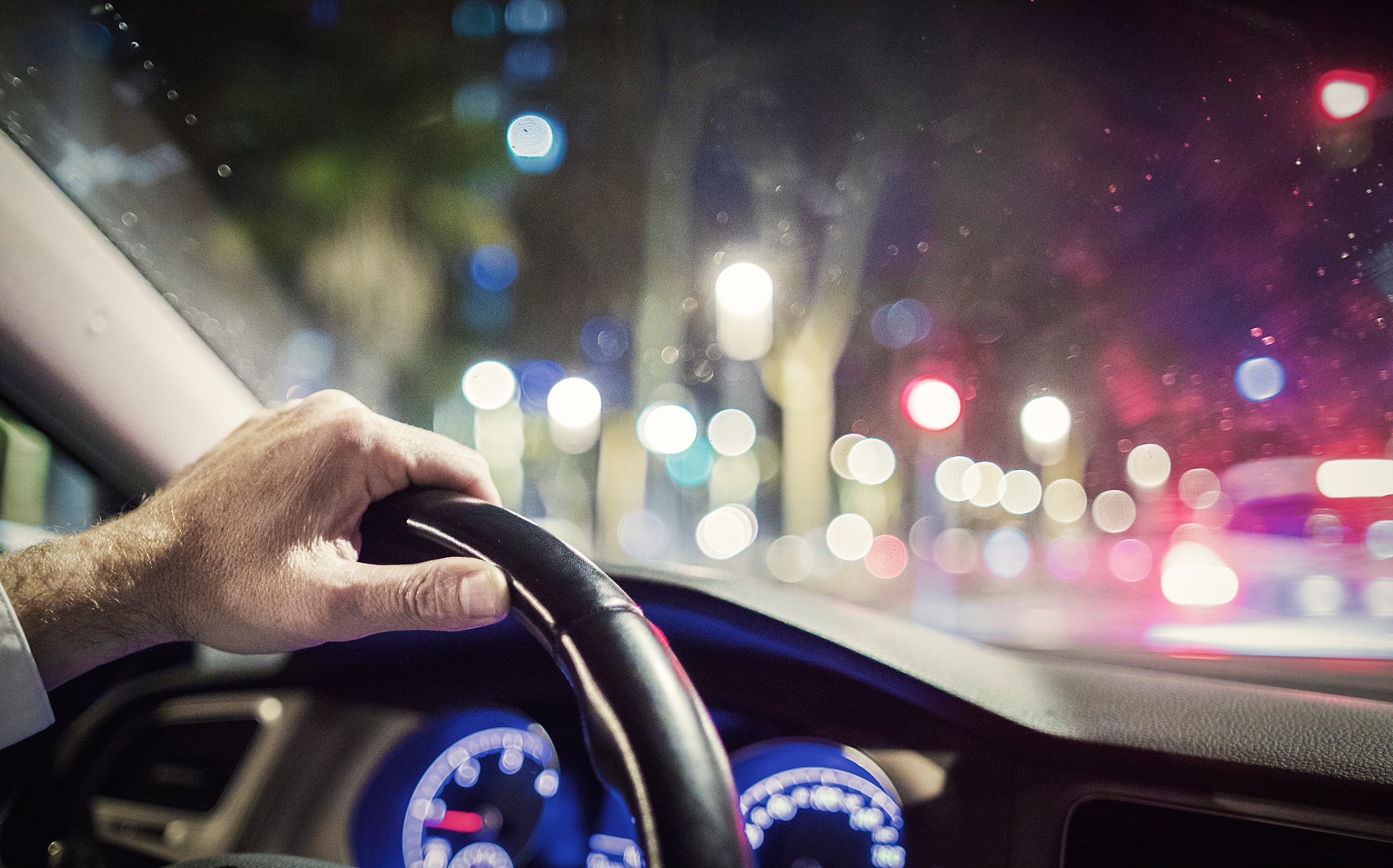 A person driving at night. 