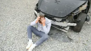 A man stressing after a car accident.